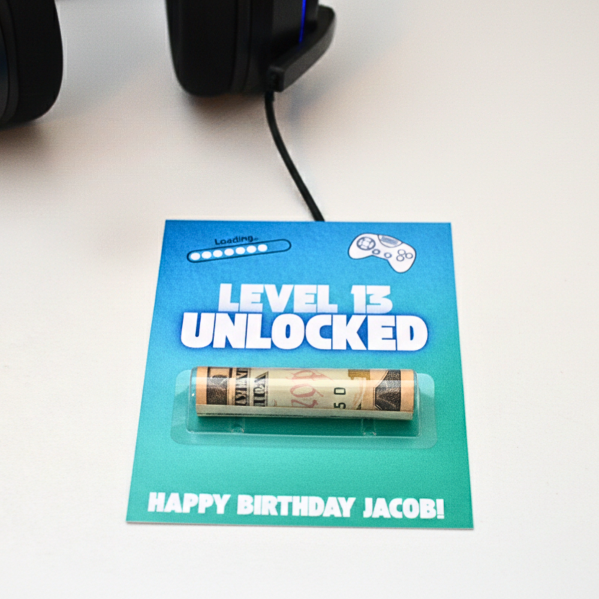 Image of blue and teal Level 13 Unlocked money holder card with Happy Birthday Jacob! on the bottom.