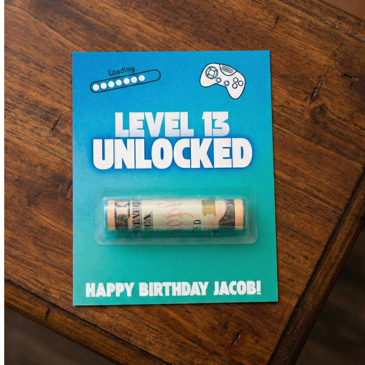 Picture of money holder card that says Loading... Level 13 Unlocked. Happy Birthday Jacob! 