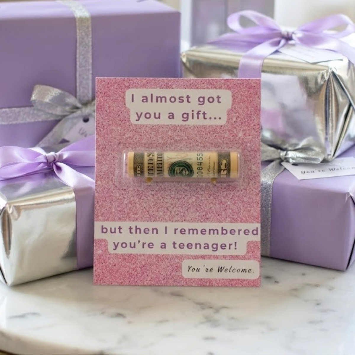 sparkly purple money holder gift card that says I almost got you a gift but then I remembered you're a teenager! You're welcome.