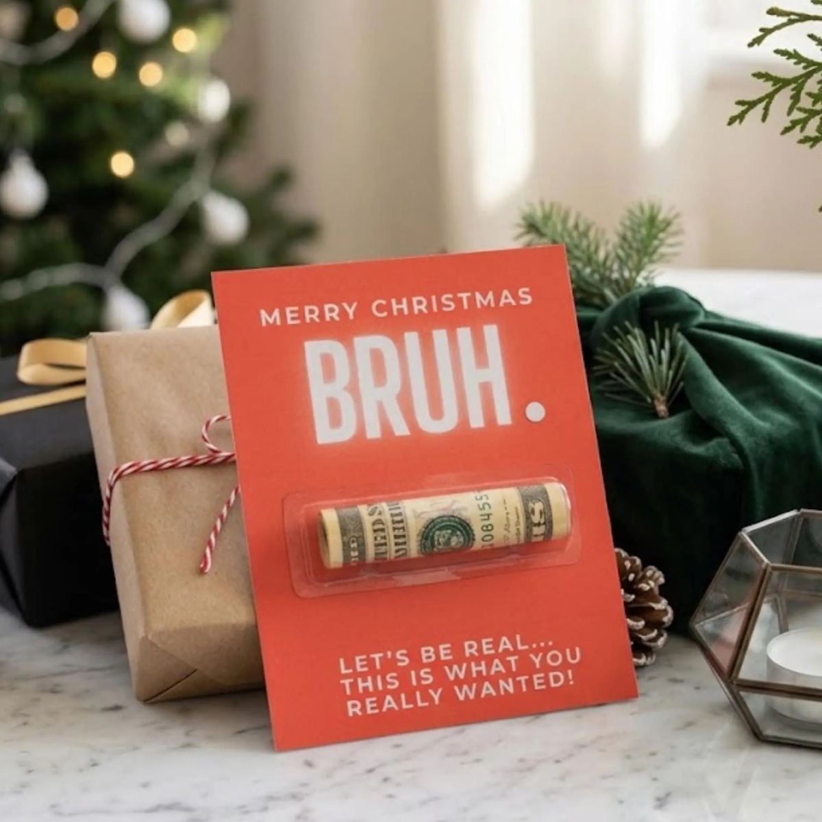 A Christmas themed money holder card that reads: Merry Christmas BRUH. Let's be real...this is what you really wanted! There is a spot in the middle of the card for rolled up bills or a check for holiday gifting.