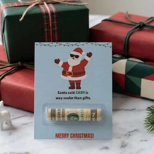 A Christmas money holder card that has a Santa with sunglasses on and says Santa said CASH is way cooler than gifts. And Merry Christmas on the bottom. Has a plastic dome in the middle of the card to put rolled up bills or a check for a holiday gift.
