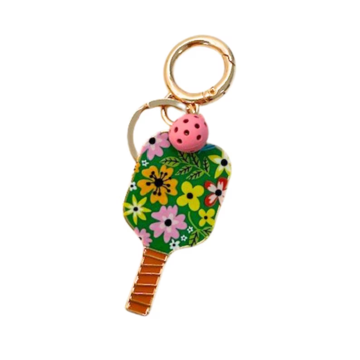 A novelty keychain shaped like a pickleball paddle, featuring a green floral pattern, a small pink ladybug charm, and gold-tone metal hardware on a plain white background.