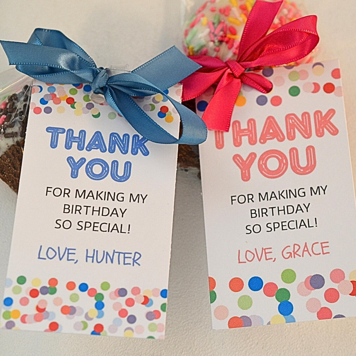 Two personalized birthday thank-you cards with colorful confetti borders and ribbon bows, displayed on a light surface.